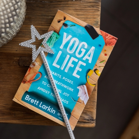 Yoga Life book about integrating yoga into your daily life off the mat with a want 